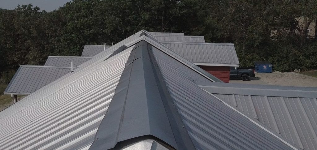 Branson Commercial Roof Metal Roofing 1 Condo complex with panel metal roofing, some of the ridge is bent