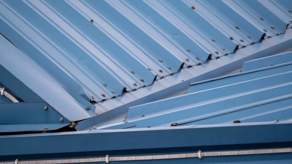 Branson Metal Roofing Installation And Repair 7 Dents in a metal roof likely from installation or maintenance also showing how fasteners on this type of roof can rust