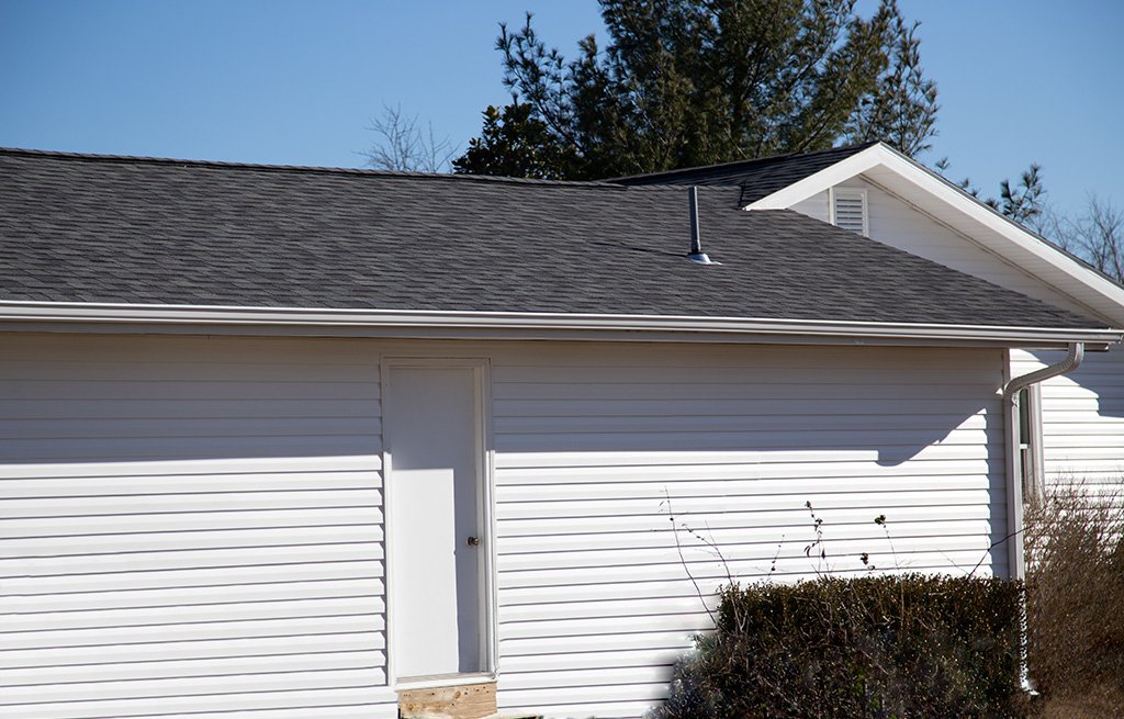 House with new roof, siding, and gutters