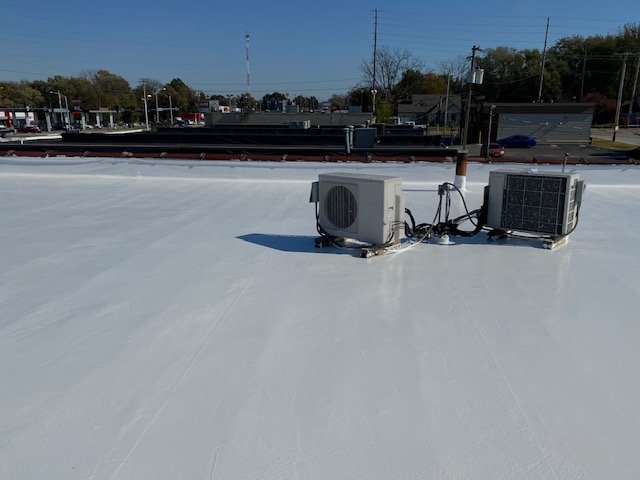 Battlefield Roofing 1 Elastomeric coating on a flat roof in springfield, mo