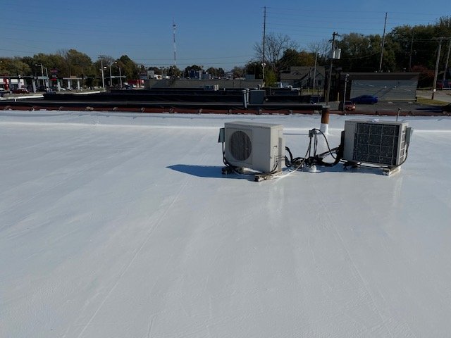 Elastomeric coating on a flat roof in springfield, mo