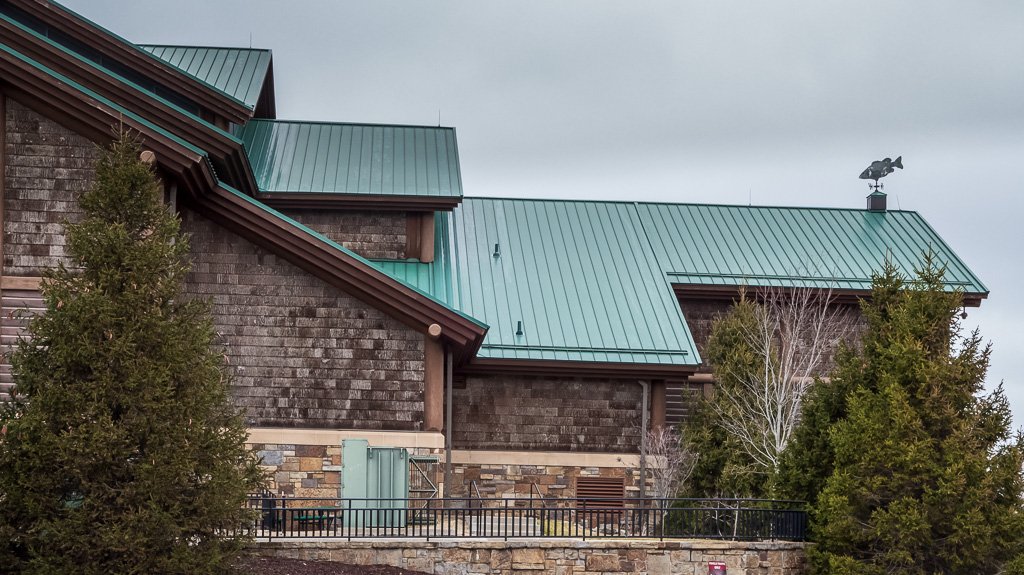 Branson Metal Roofing Installation And Repair 8 Green standing seam steel roof with snow bars in springfield mo