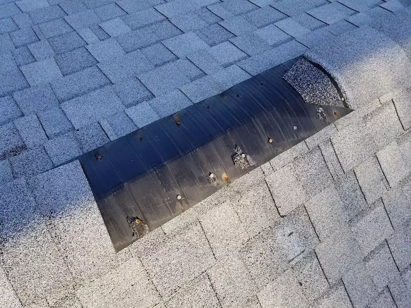 Ridge cap missing after wind blew the shingles off