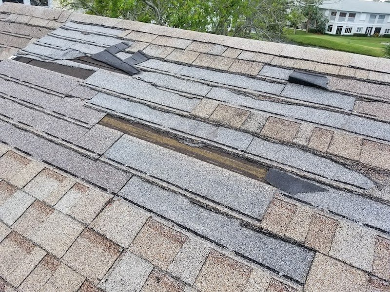 Roof Leak Repair 13 Roof leak caused by shingles torn off by wind