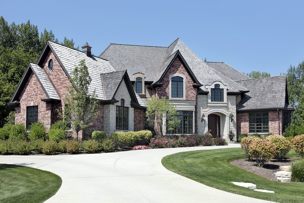 Wood shake roof on a large brick home