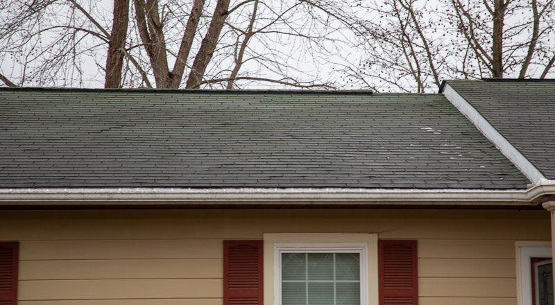 Your Best Source For Wind Damage Roof Repair 6 House in rolla, mo with wind damage shingles.