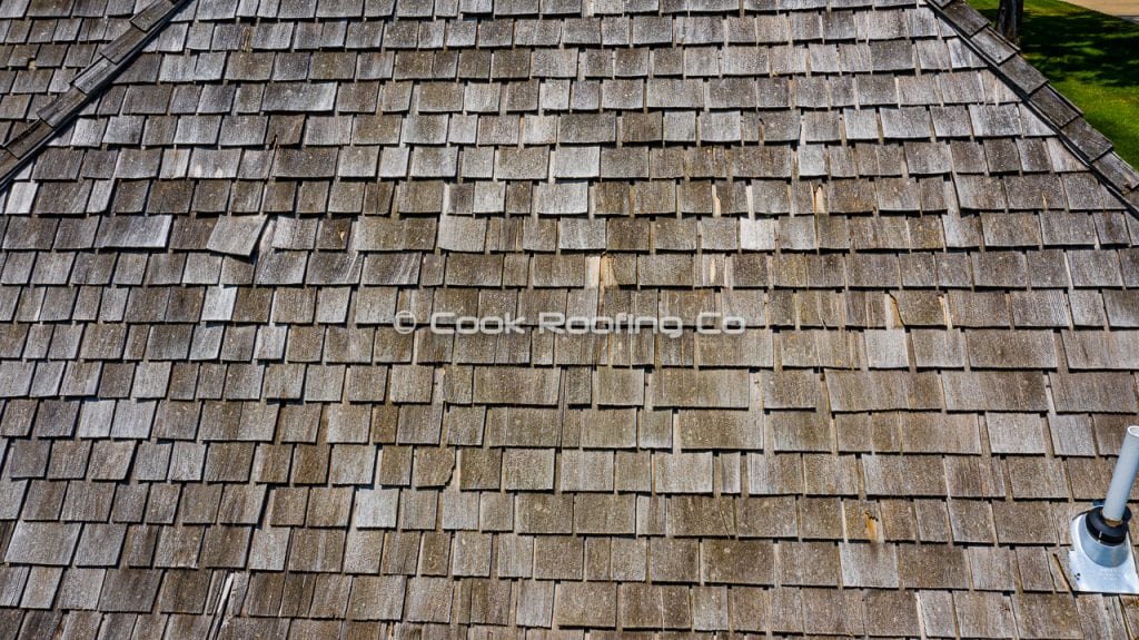 Springfield Roofing Company | Cook Roofing Company 2 Wood shingles with hail damage in springfield mo